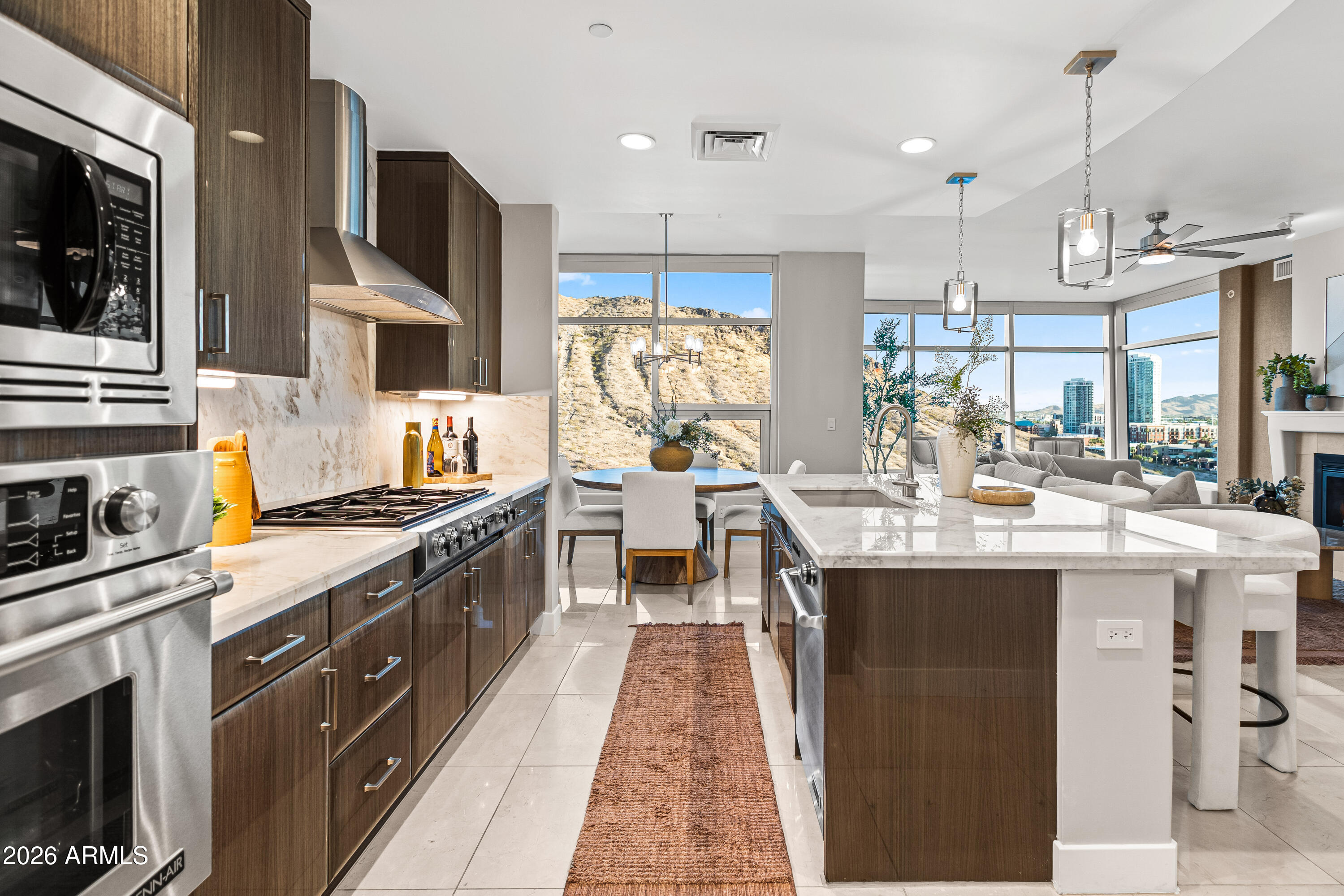 140 East Rio Salado Parkway, Unit 1101 Tempe, AZ 85281 - Photo 7 of 32 a kitchen with stainless steel appliances granite countertop a sink and a stove