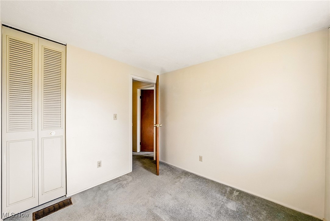 803 Renninger Road Akron, OH 44319 - Photo 31 of 44 Unfurnished bedroom featuring visible vents, carpet floors, and a closet