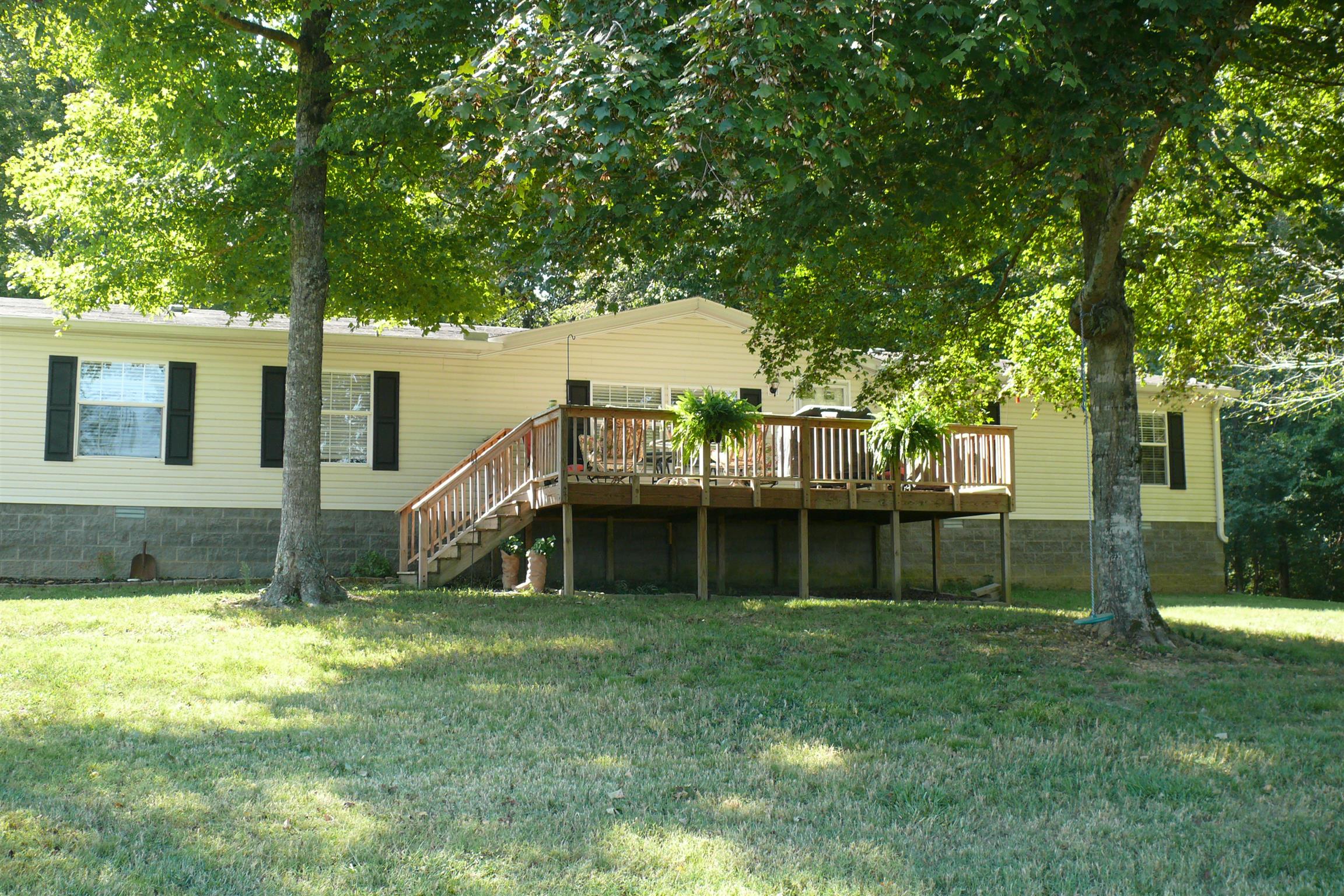 400 Jesse Work Road Dickson, TN 37055 - Photo 1 of 9 a view of a house with a big yard and large trees