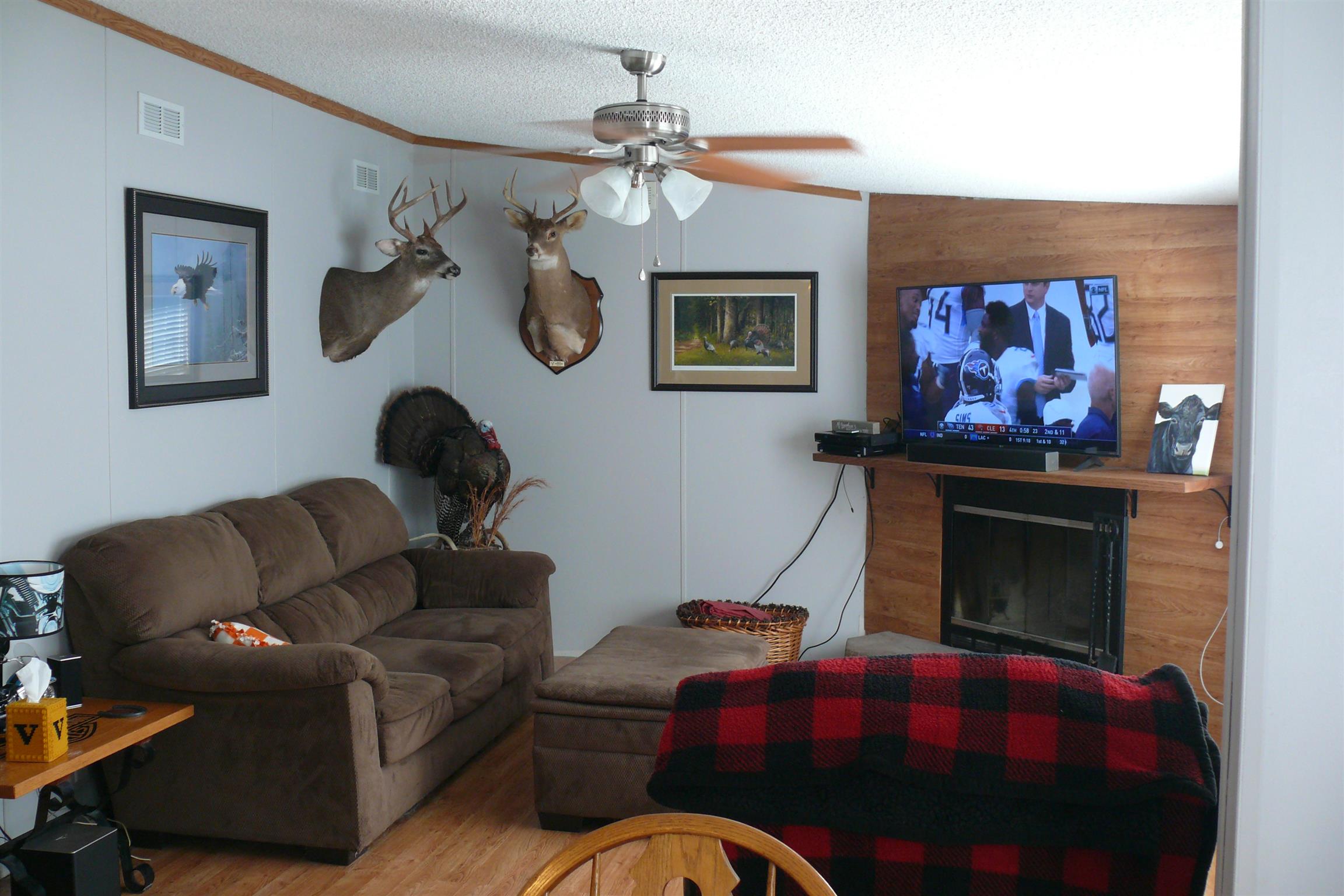 400 Jesse Work Road Dickson, TN 37055 - Photo 2 of 9 a living room with furniture and a fireplace