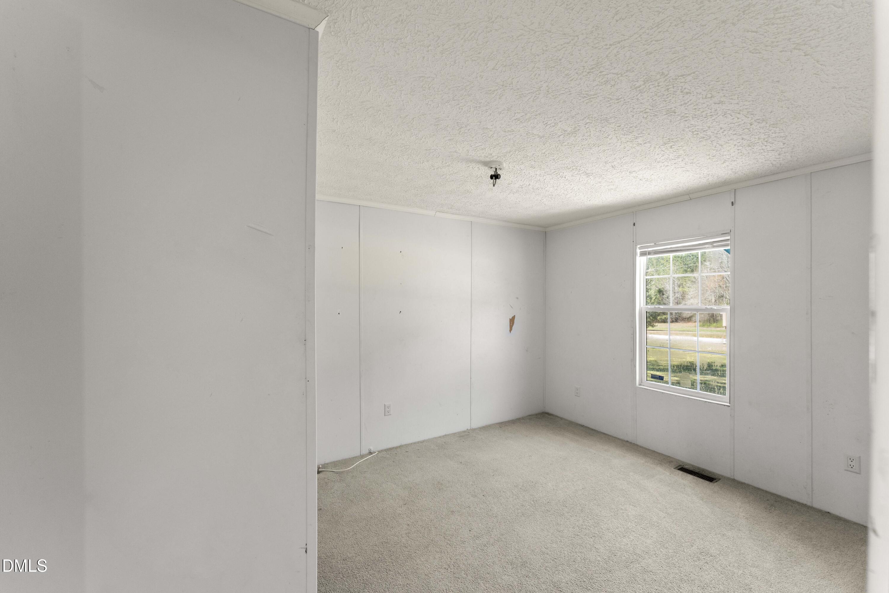 501 Macon-Embro Road Macon, NC 27551 - Photo 19 of 37 an empty room with windows