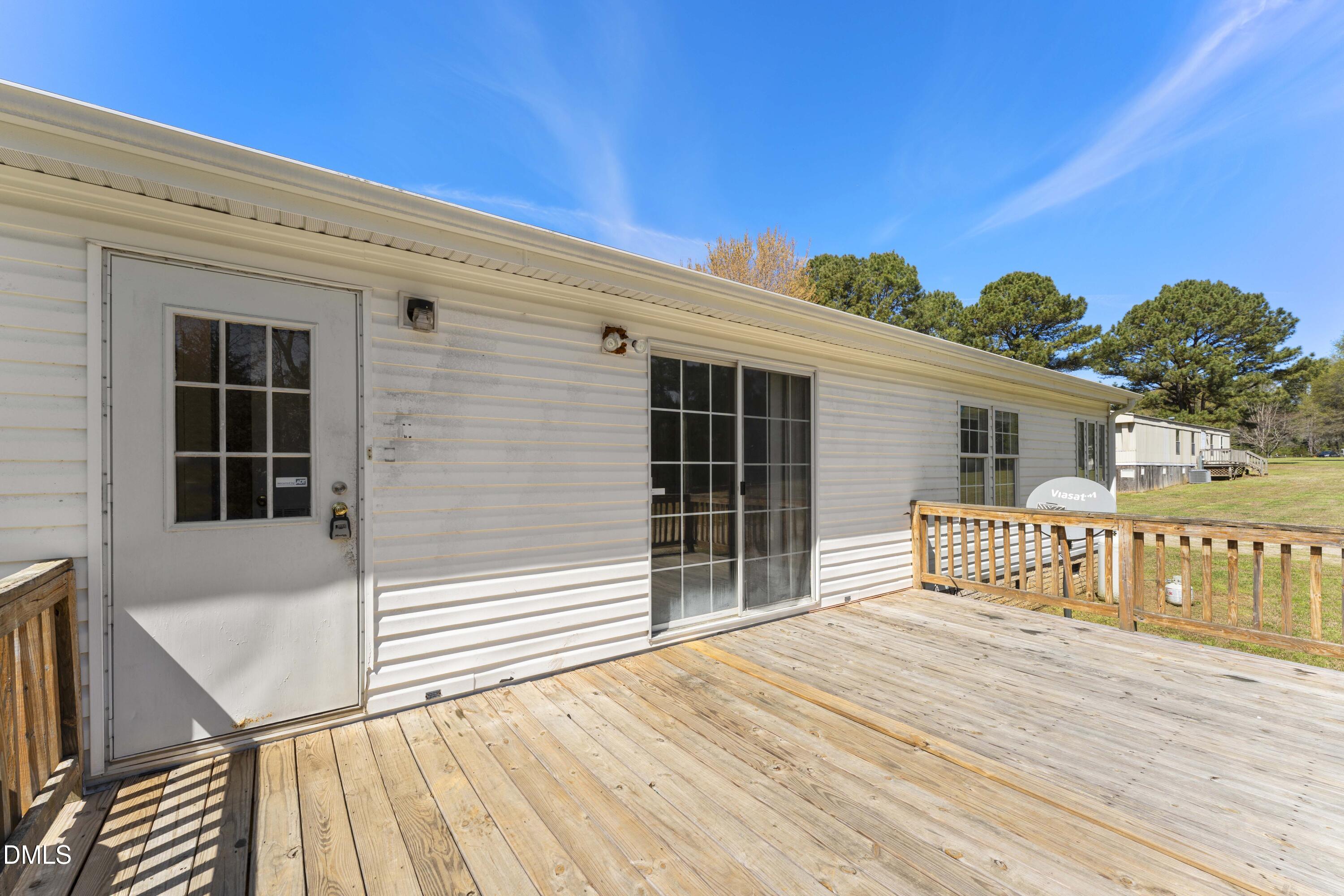 501 Macon-Embro Road Macon, NC 27551 - Photo 24 of 37 front view of a house with a wooden deck