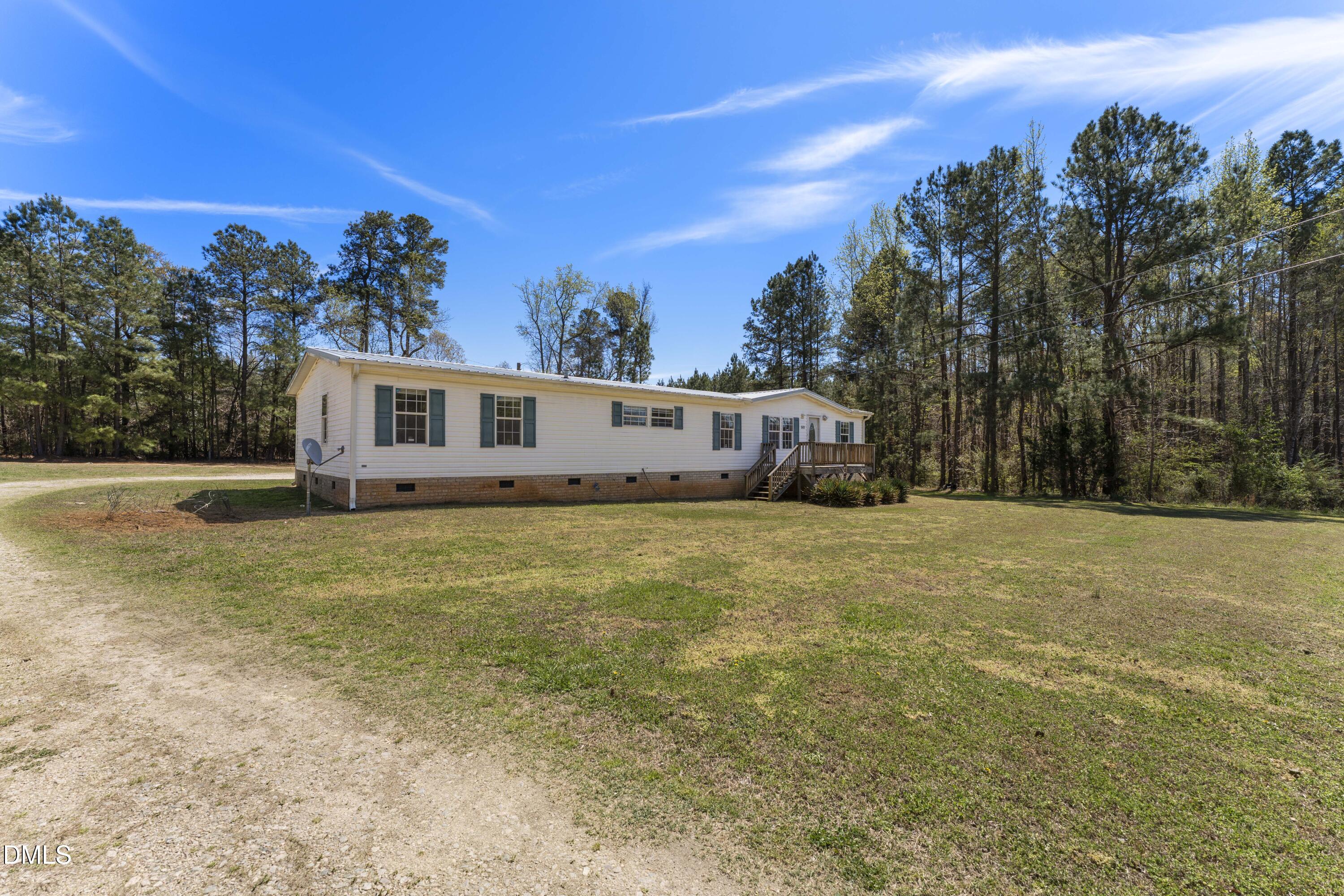 501 Macon-Embro Road Macon, NC 27551 - Photo 36 of 37 a view of a house with a backyard