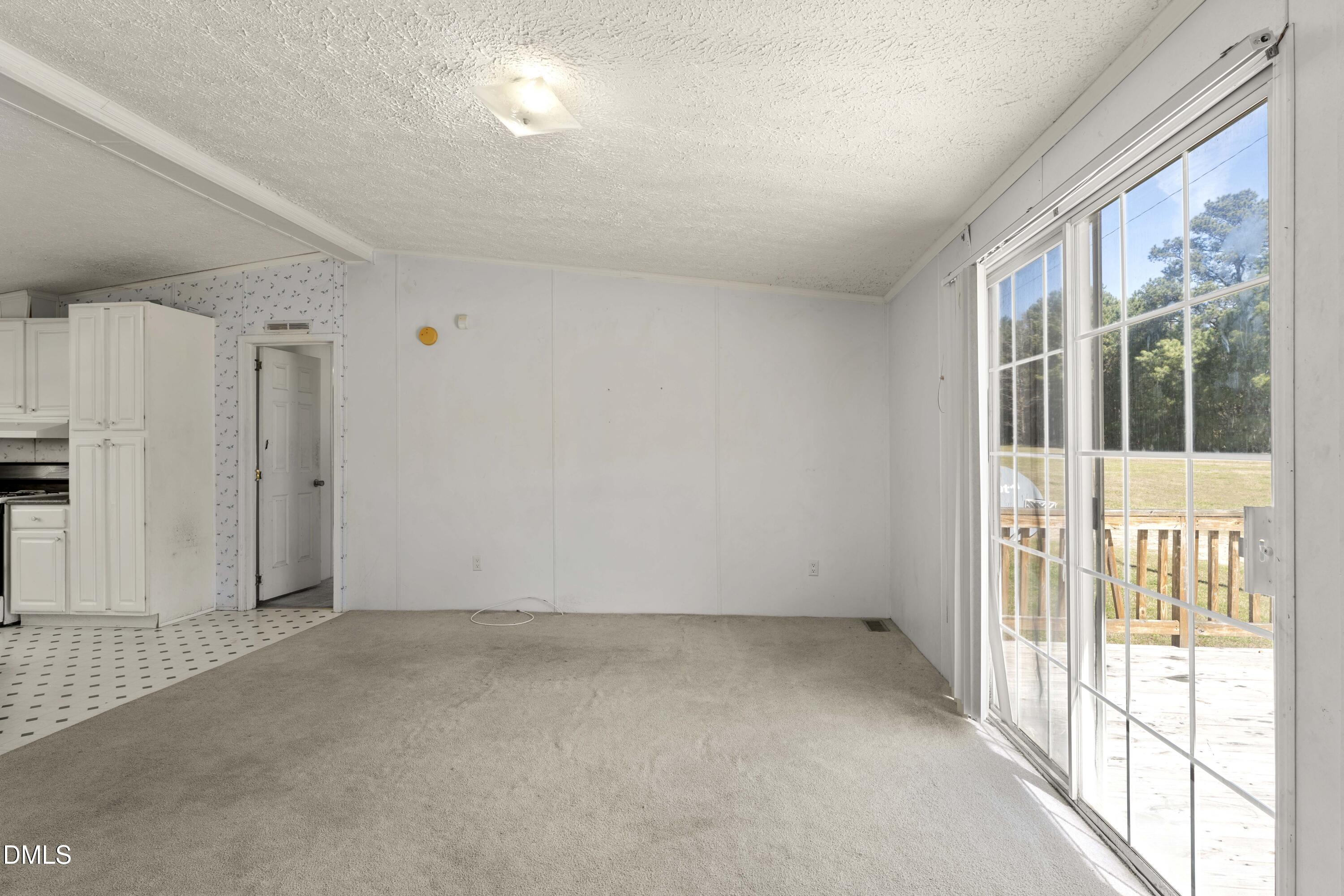 501 Macon-Embro Road Macon, NC 27551 - Photo 8 of 37 a view of an empty room with a window