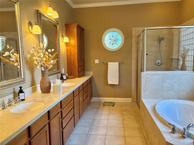 a bedroom with a bed and lamp