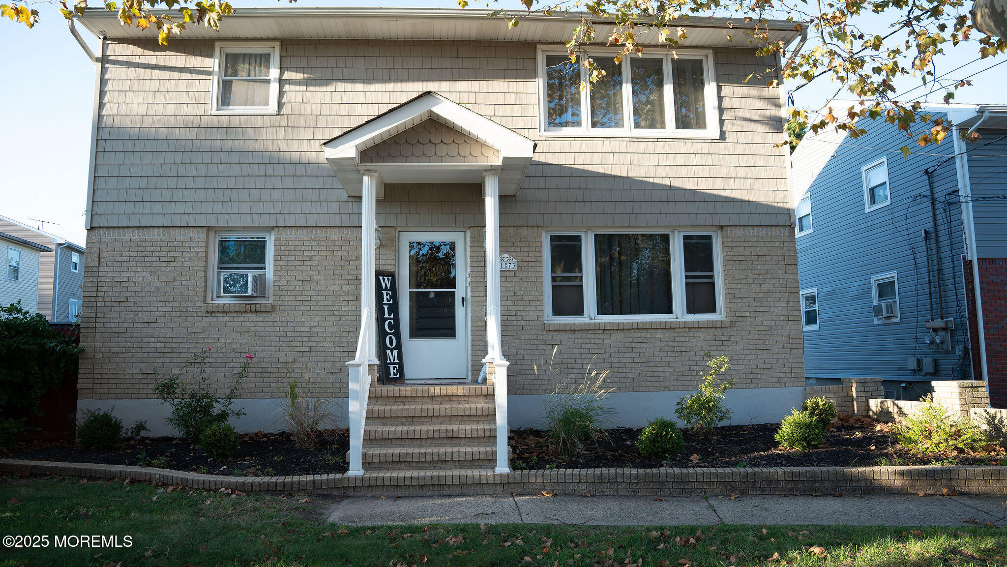 73 Maple Avenue, Unit 2 Keansburg, NJ 07734 - Photo 2 of 33 a front view of a house with a yard