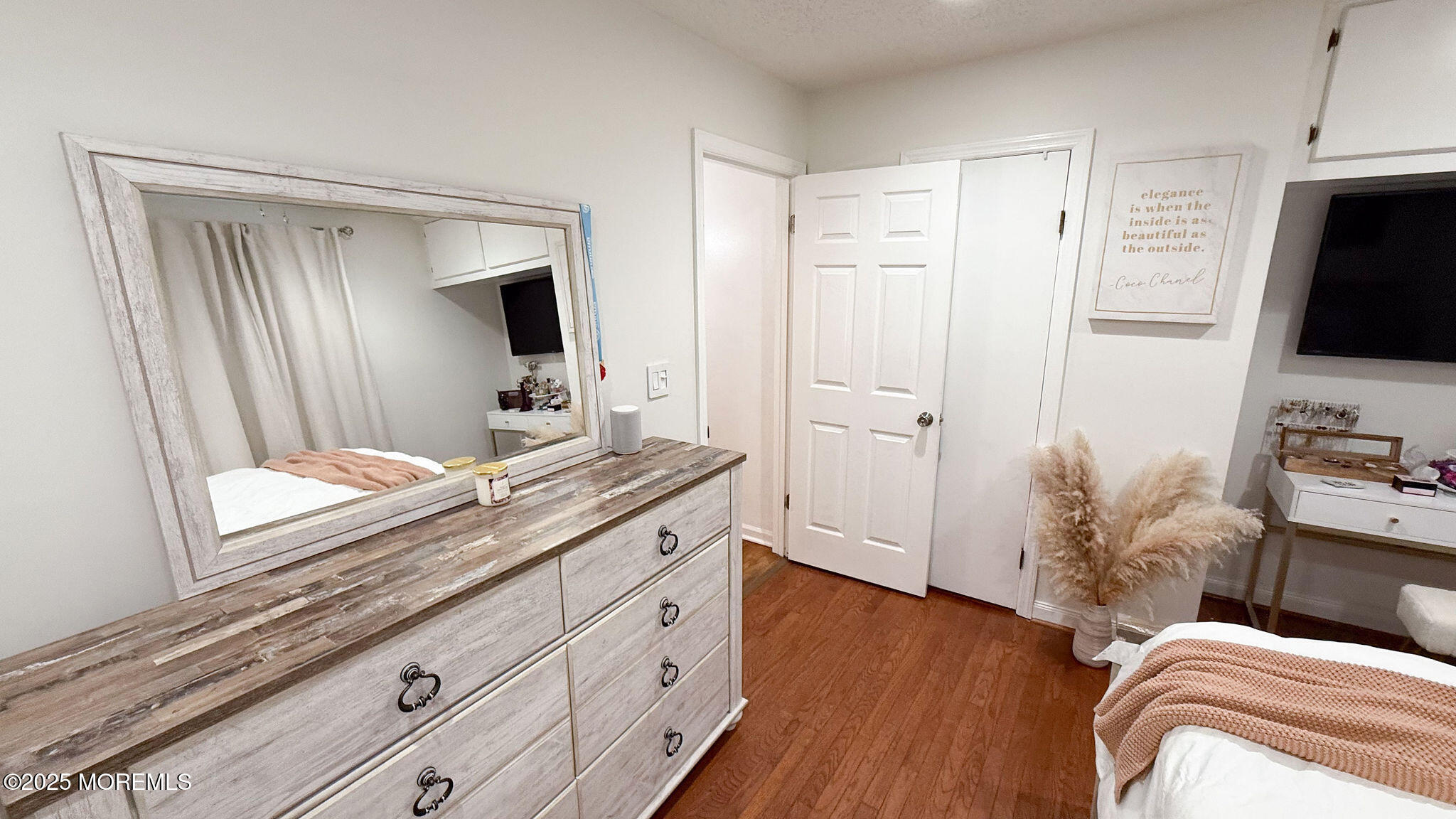 73 Maple Avenue, Unit 2 Keansburg, NJ 07734 - Photo 23 of 33 a bedroom with a bed and a flat screen tv