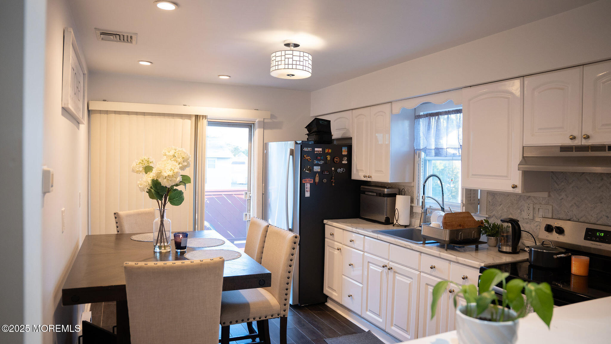 73 Maple Avenue, Unit 2 Keansburg, NJ 07734 - Photo 25 of 33 a kitchen with a table and chairs