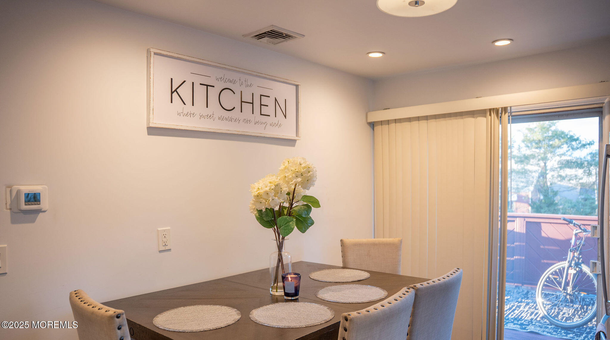 73 Maple Avenue, Unit 2 Keansburg, NJ 07734 - Photo 28 of 33 a view of a dining room with furniture and a potted plant