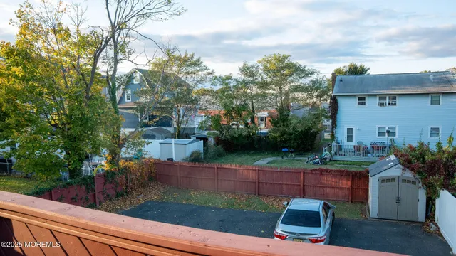 a view of a backyard with plants and a patio