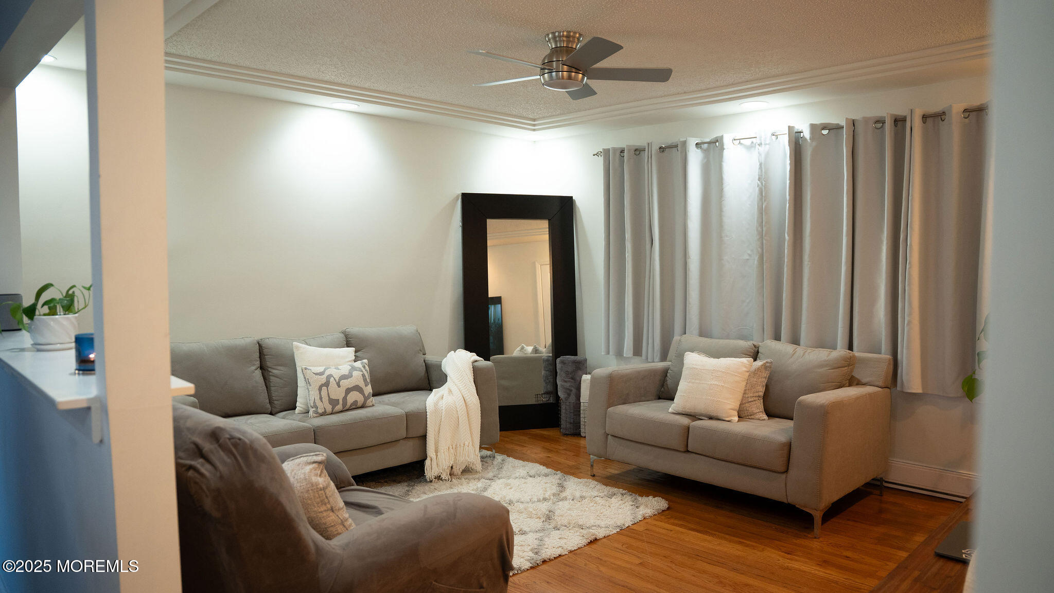 73 Maple Avenue, Unit 2 Keansburg, NJ 07734 - Photo 7 of 33 a living room with furniture and a window