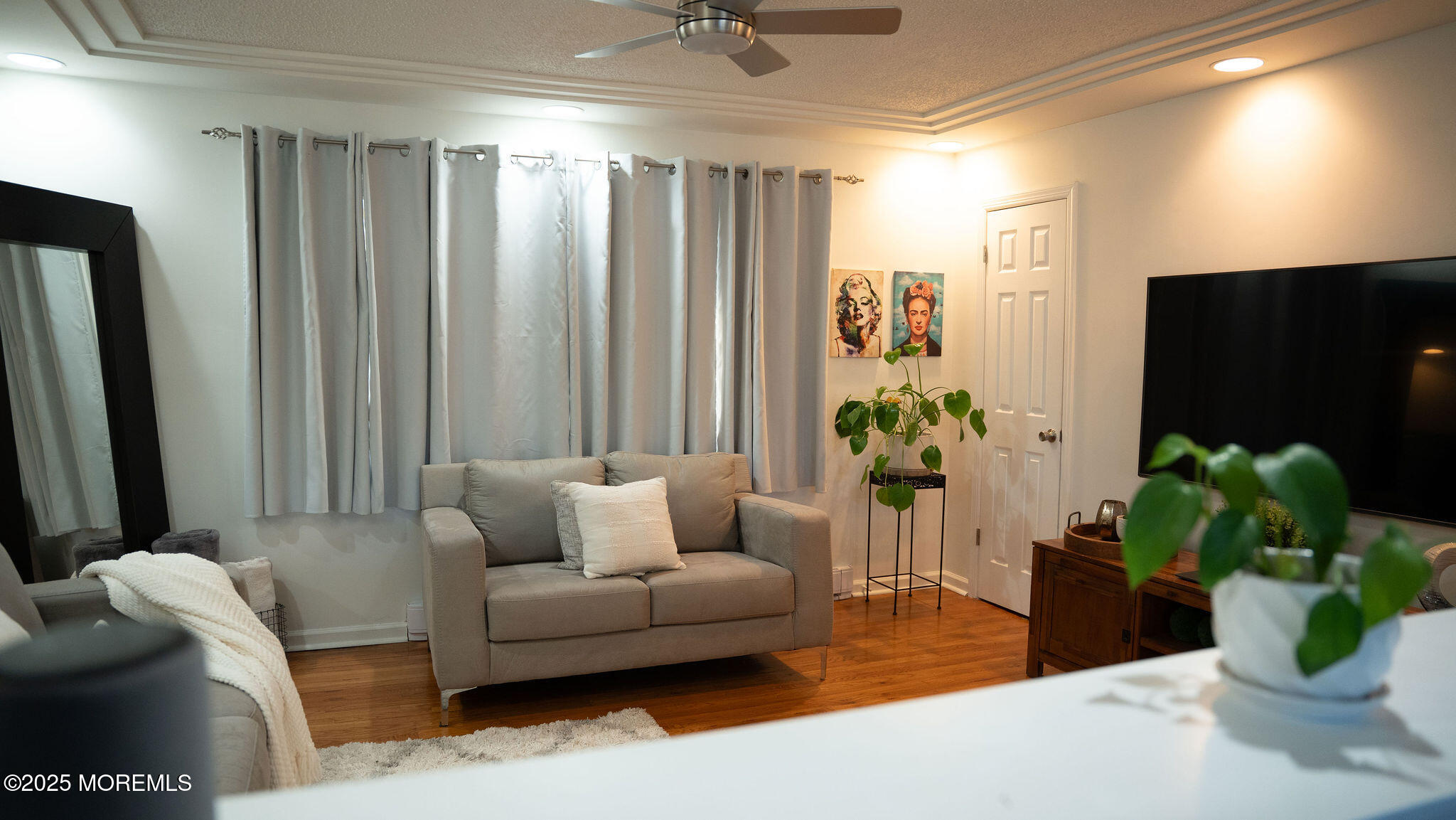 73 Maple Avenue, Unit 2 Keansburg, NJ 07734 - Photo 10 of 33 a living room with furniture and a potted plant
