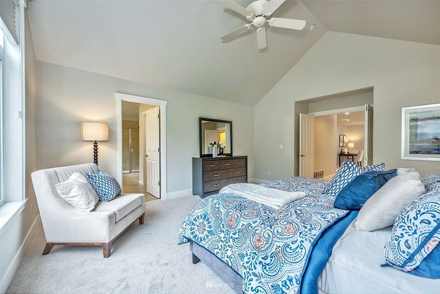 a bedroom with a bed and couch