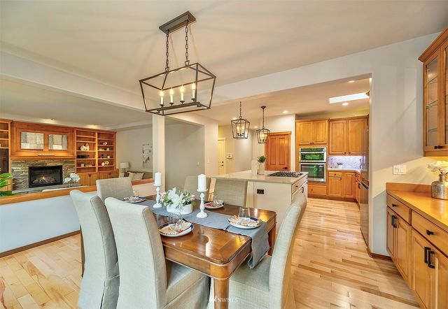 a large kitchen with a table and chairs