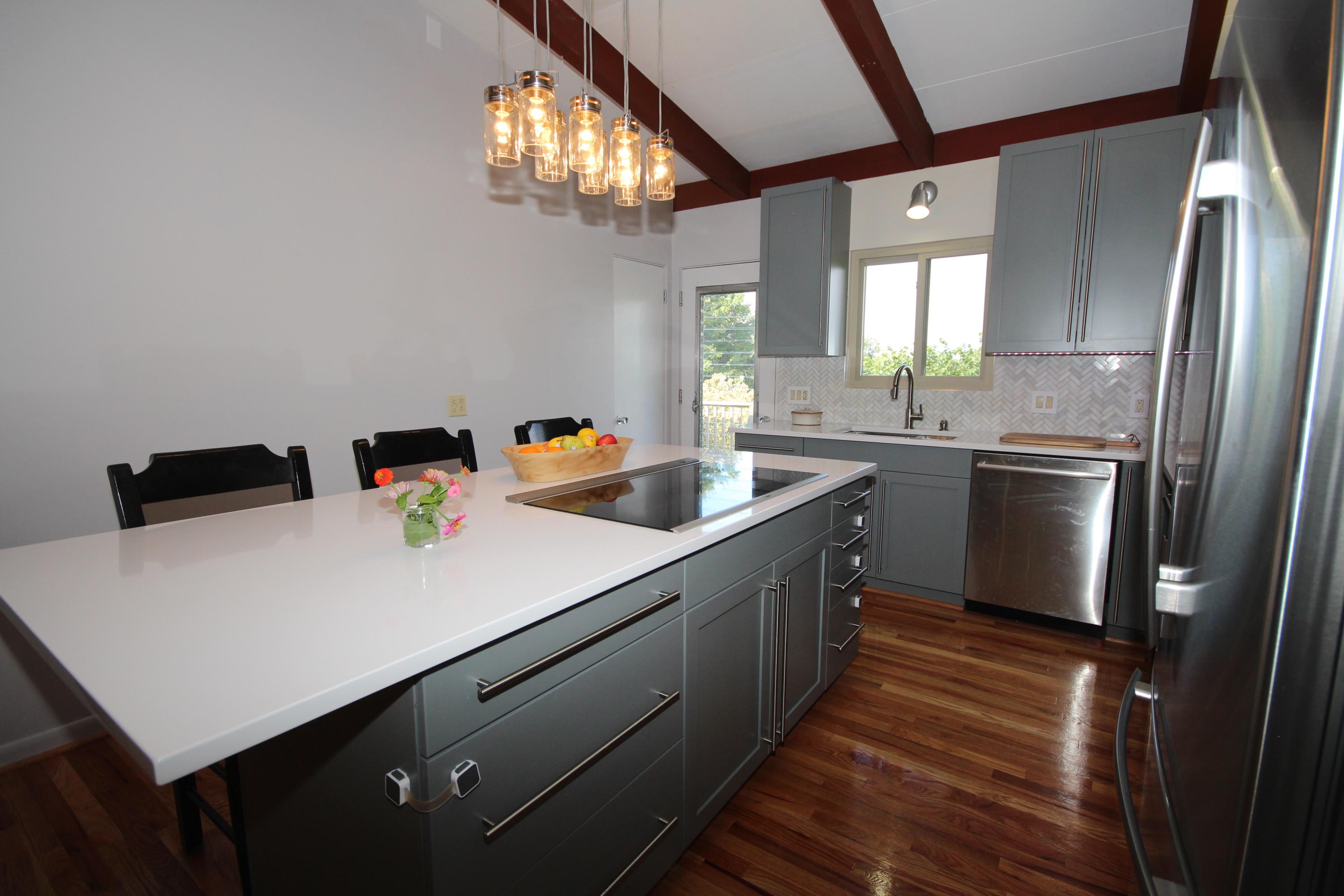 4507 Rosecrest Road Roanoke, VA 24018 - Photo 11 of 41 a kitchen with stainless steel appliances a sink dishwasher and a refrigerator with wooden floor