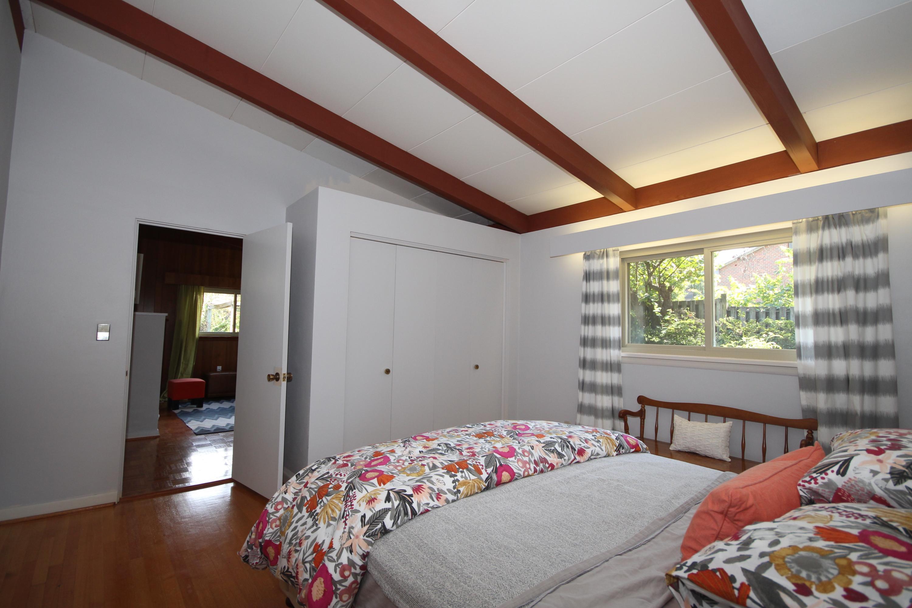 4507 Rosecrest Road Roanoke, VA 24018 - Photo 19 of 41 a bedroom with a bed and a large window with outer view