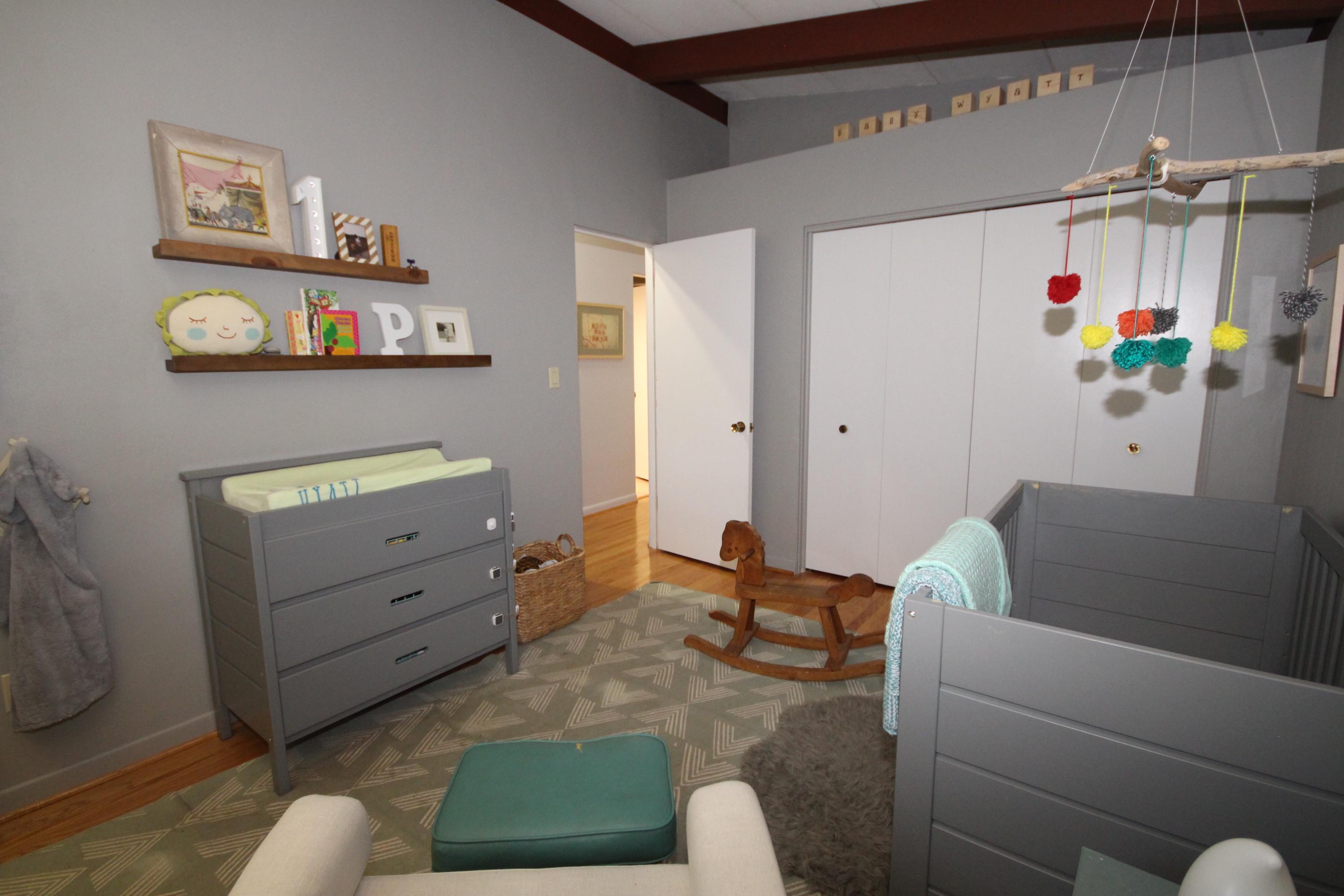 4507 Rosecrest Road Roanoke, VA 24018 - Photo 23 of 41 a living room with furniture and a baby crib