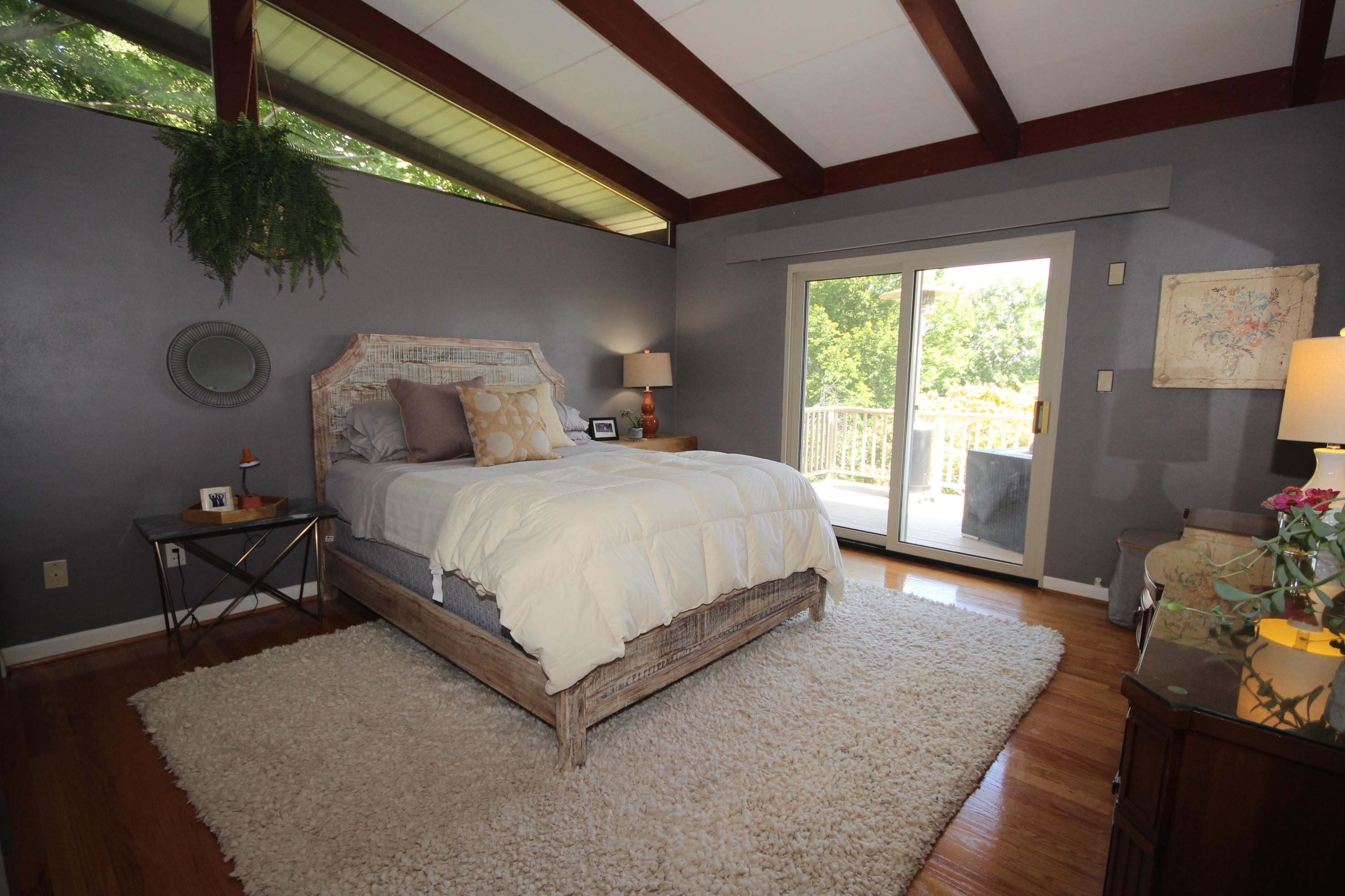 4507 Rosecrest Road Roanoke, VA 24018 - Photo 24 of 41 a bedroom with a bed window and a potted plant