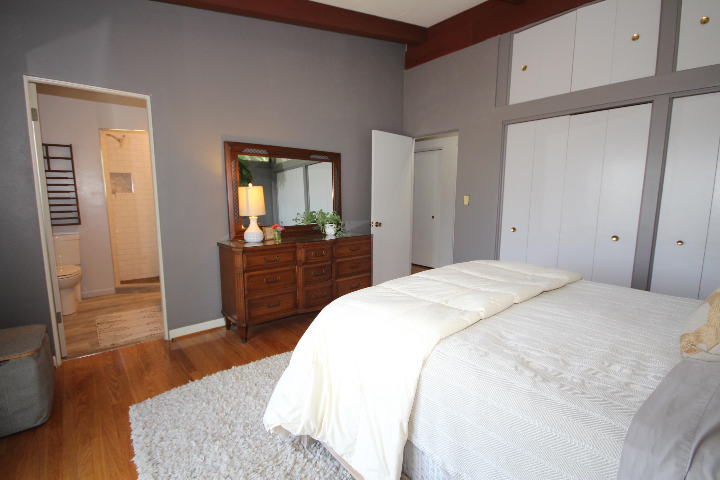 4507 Rosecrest Road Roanoke, VA 24018 - Photo 26 of 41 a spacious bedroom with a bed and wooden floor