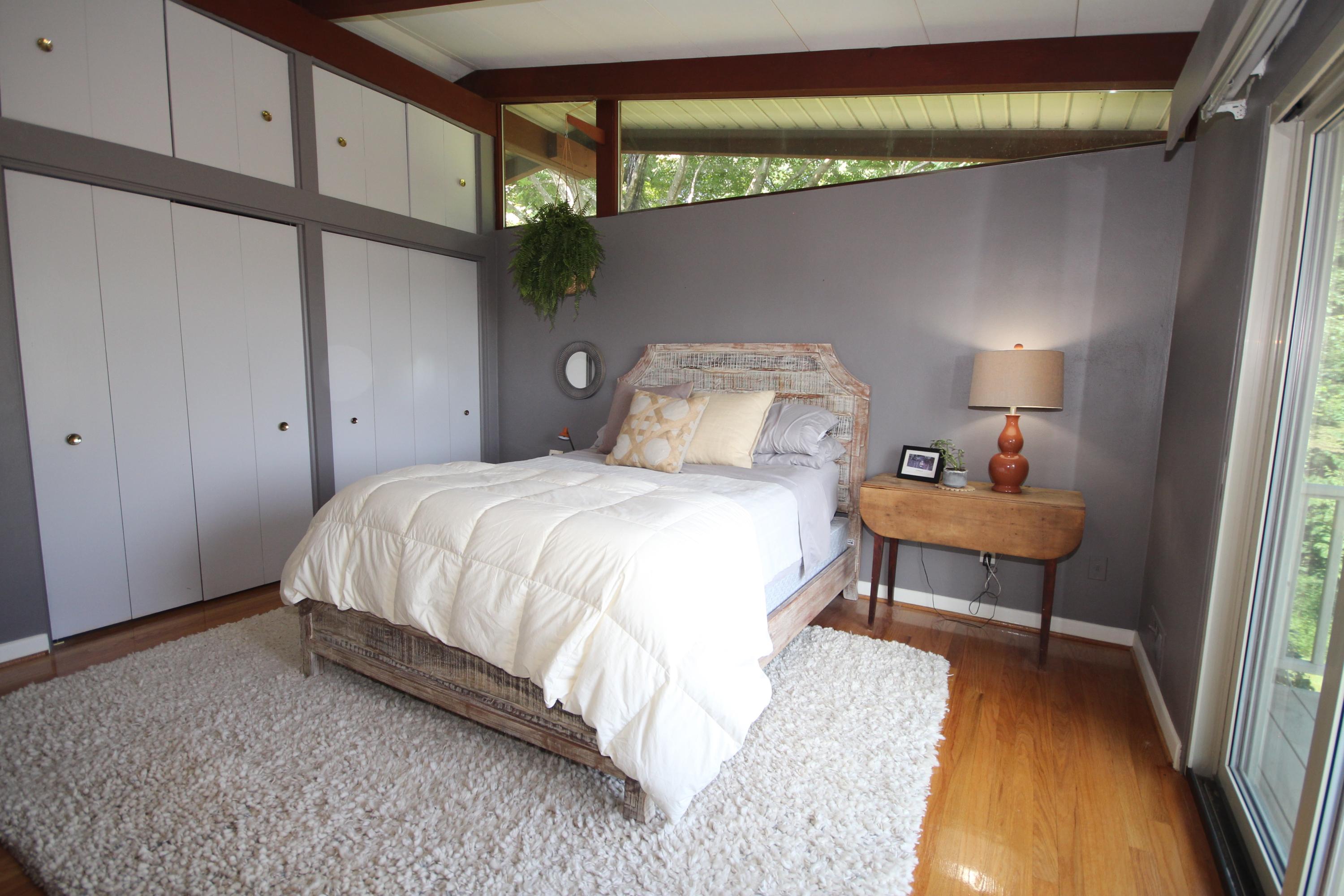 4507 Rosecrest Road Roanoke, VA 24018 - Photo 27 of 41 a spacious bedroom with a bed and a table in it