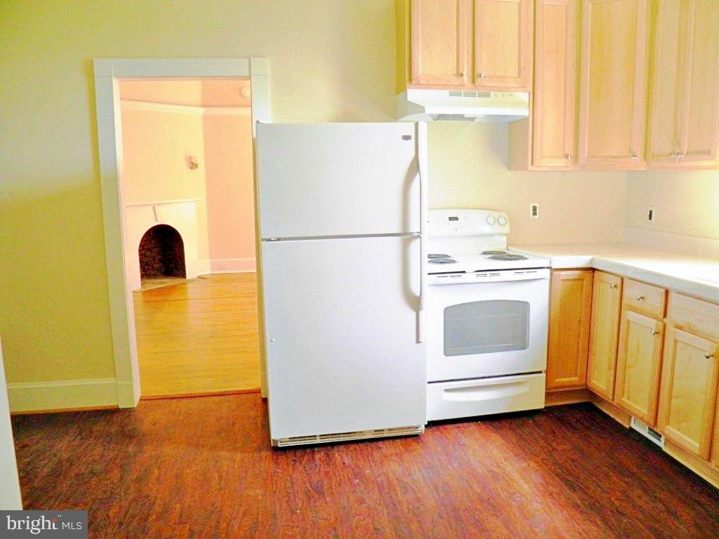 102 East A Street Brunswick, MD 21716 - Photo 5 of 18 a kitchen with a refrigerator and a stove