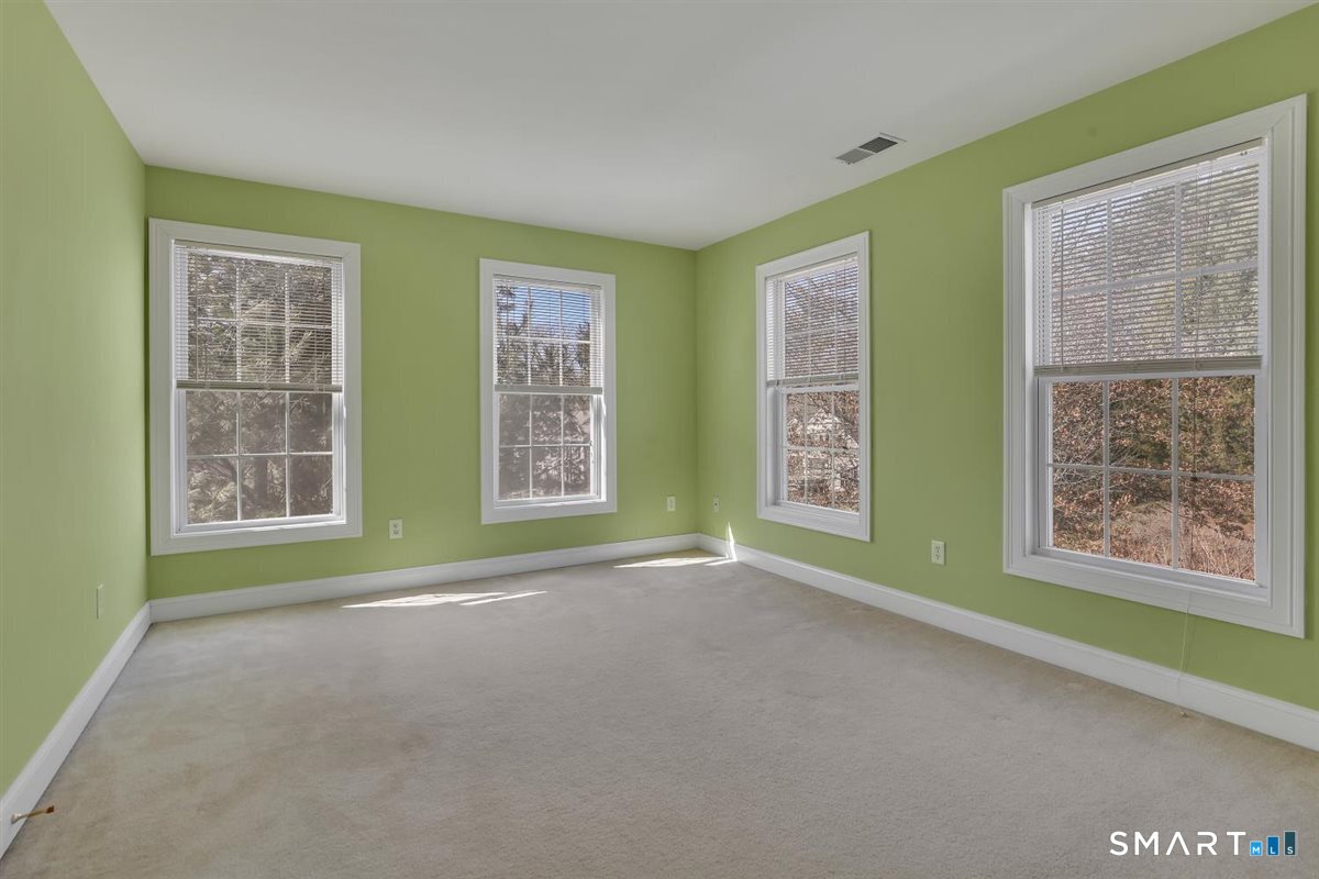 25 Fenwick Drive Avon, CT 06001 - Photo 25 of 40 a view of an empty room with a window