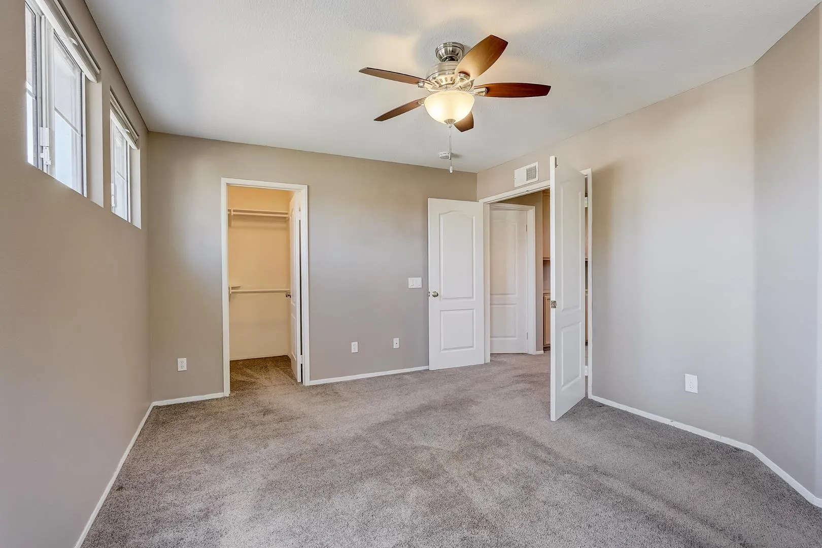 4824 Contour Court Oceanside, CA 92057 - Photo 13 of 32 an empty room with closet and a chandelier fan