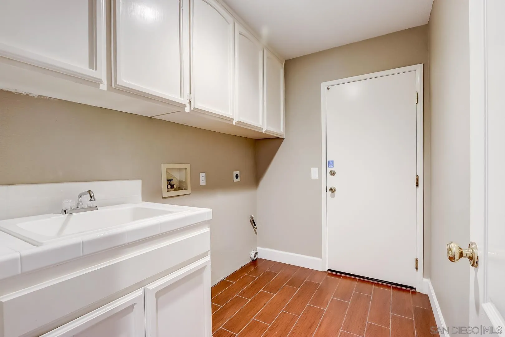 4824 Contour Court Oceanside, CA 92057 - Photo 20 of 32 a room with a sink and cabinets