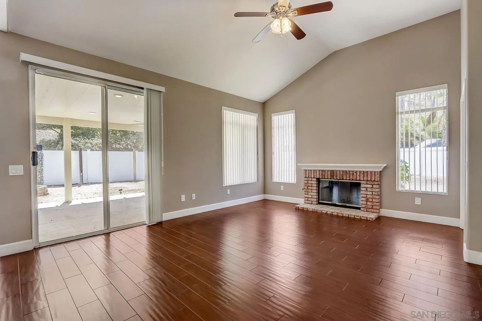 4824 Contour Court Oceanside, CA 92057 - Photo 28 of 32 a view of an empty room with wooden floor and a window