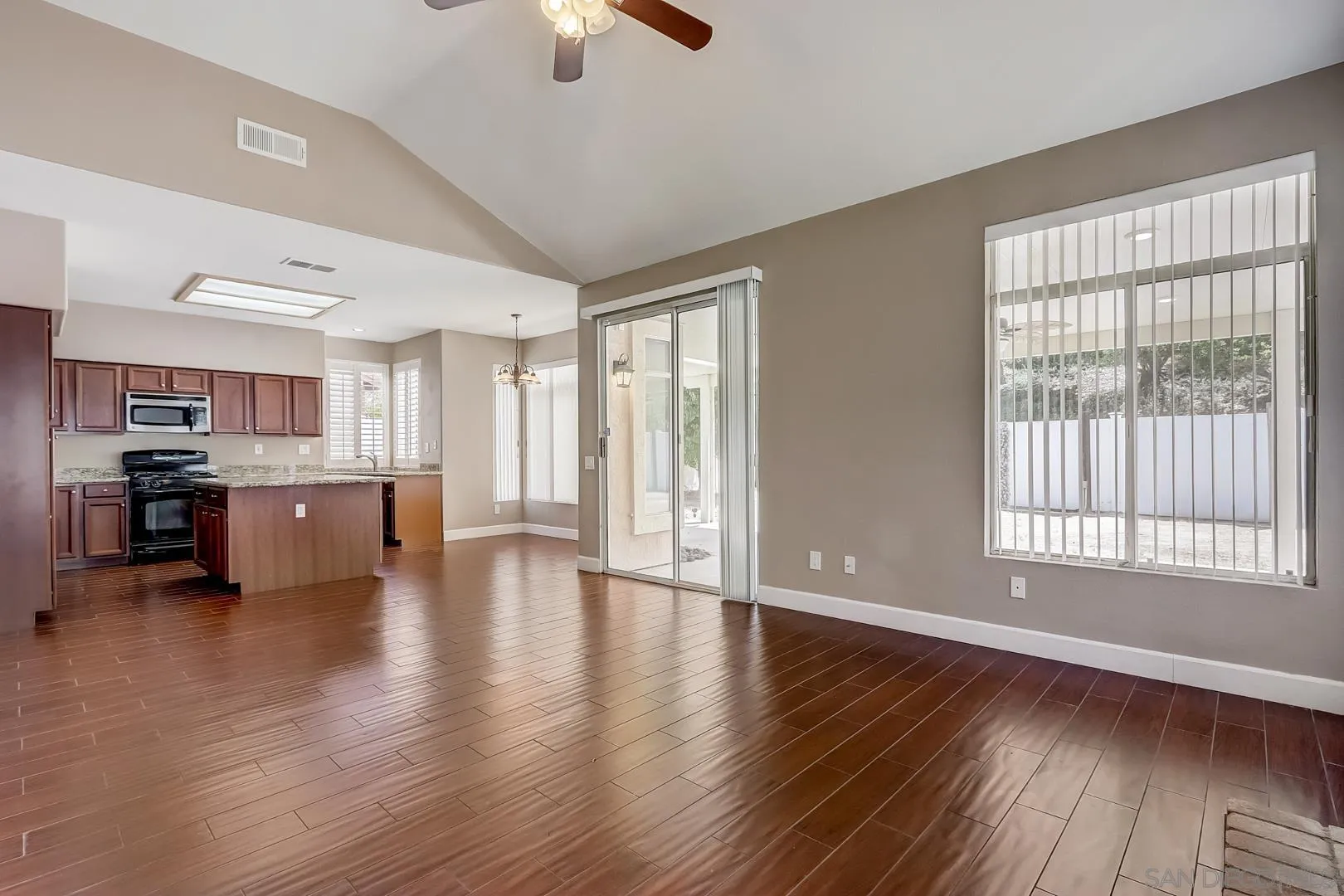 4824 Contour Court Oceanside, CA 92057 - Photo 29 of 32 a view of an empty room with kitchen and window