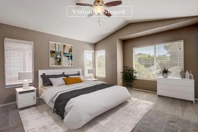 4824 Contour Court Oceanside, CA 92057 - Photo 3 of 32 a bedroom with a large bed and a chandelier