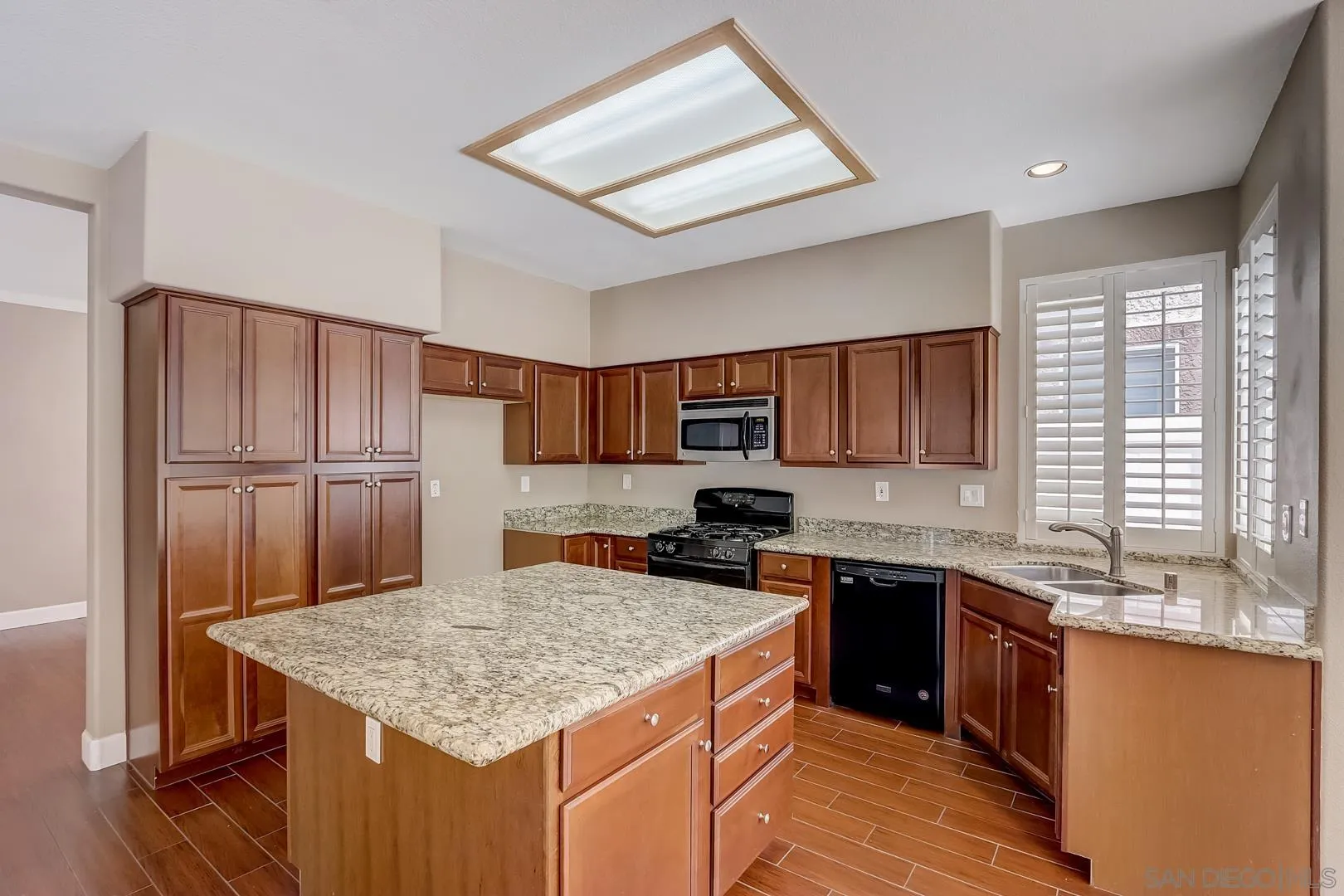 4824 Contour Court Oceanside, CA 92057 - Photo 4 of 32 a kitchen with stainless steel appliances granite countertop a sink stove and refrigerator