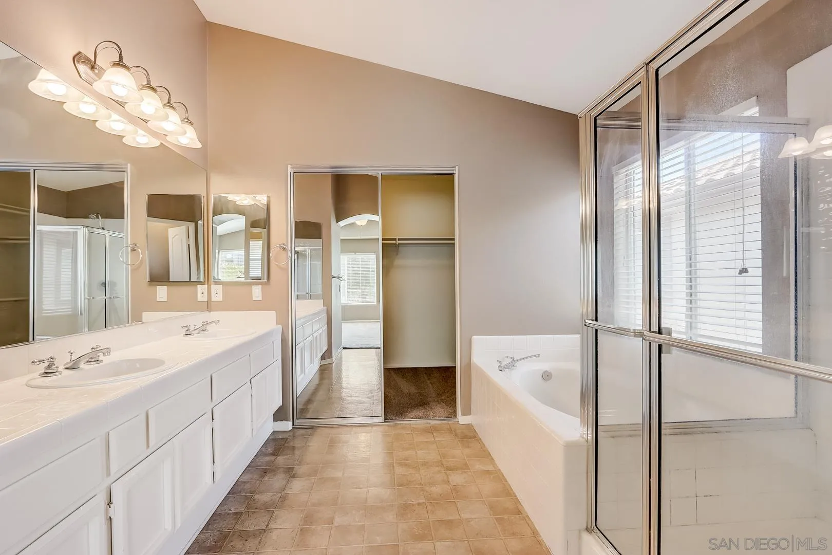 4824 Contour Court Oceanside, CA 92057 - Photo 8 of 32 a spacious bathroom with a bathtub sink and mirror