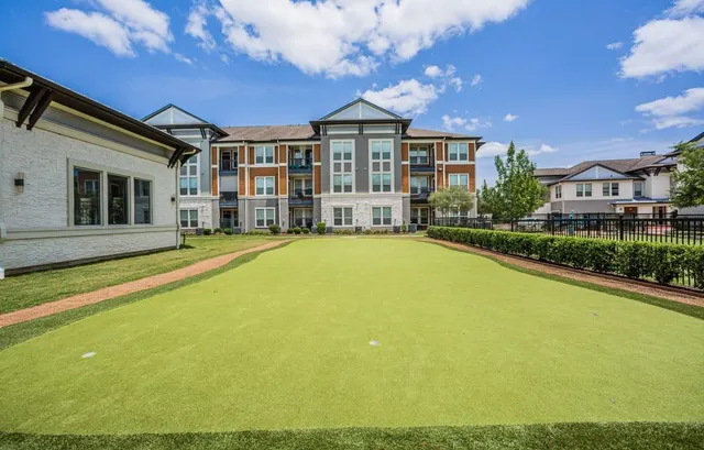 a view of a house with swimming pool and porch