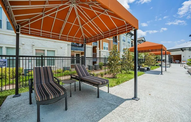 a patio with a yard table and chairs