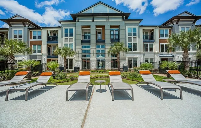 a backyard of a house with outdoor seating