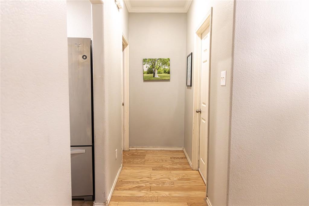 104 South Forest Grove Princeton, TX 75407 - Photo 11 of 36 a view of a hallway with wooden floor