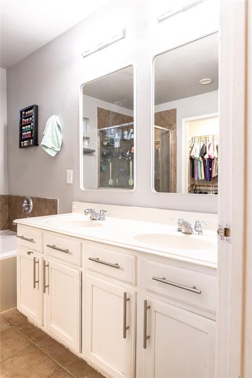 104 South Forest Grove Princeton, TX 75407 - Photo 20 of 36 a view of a sink and a mirror