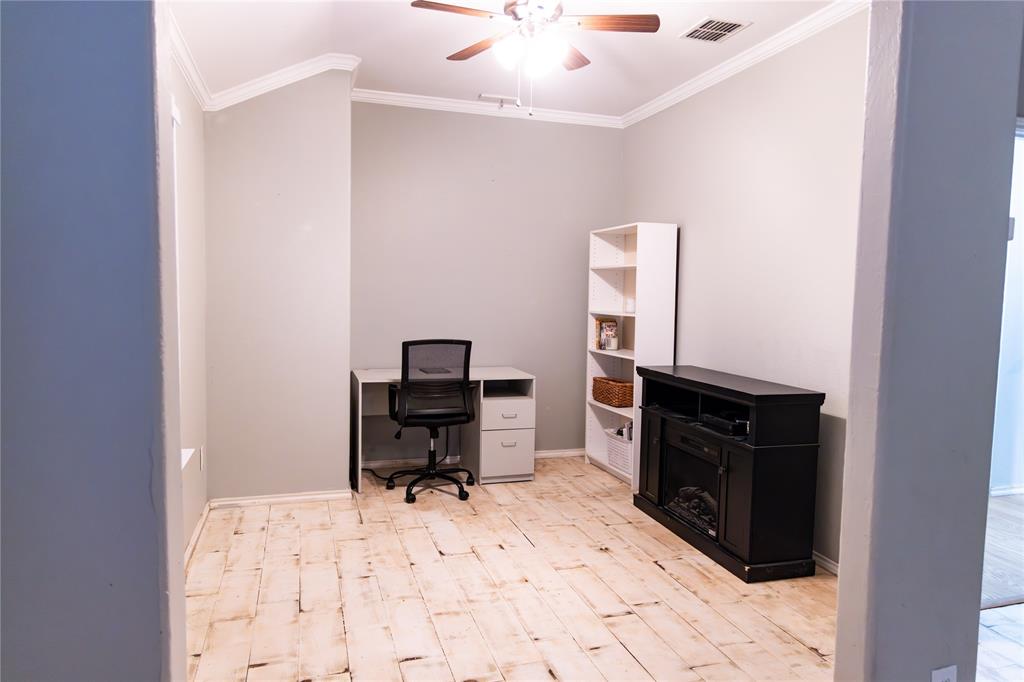 104 South Forest Grove Princeton, TX 75407 - Photo 25 of 36 a room with a computer on a desk and chair