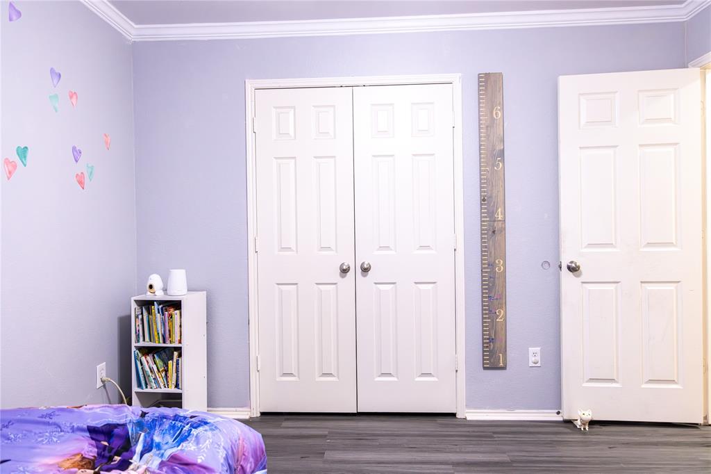 104 South Forest Grove Princeton, TX 75407 - Photo 28 of 36 a view of bedroom with baby crib and closet