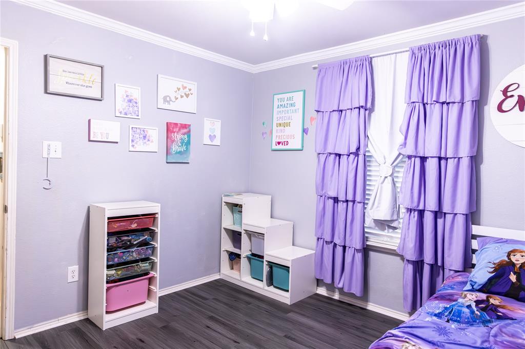 104 South Forest Grove Princeton, TX 75407 - Photo 30 of 36 a living room with furniture and wooden floor