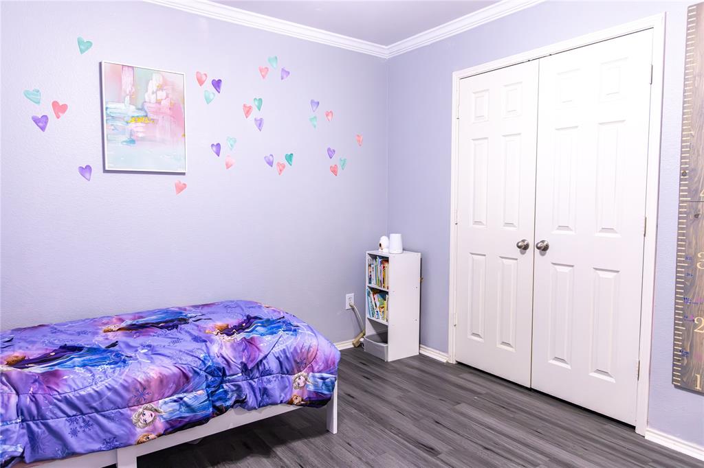 104 South Forest Grove Princeton, TX 75407 - Photo 31 of 36 a bedroom with a bed and a window