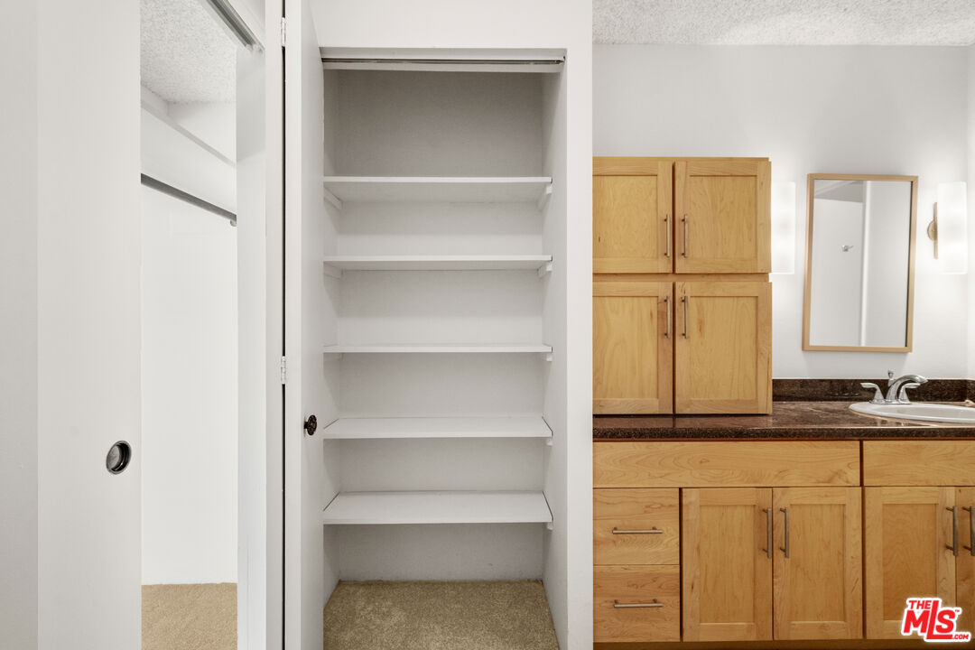 1302 Raintree Circle Culver City, CA 90230 - Photo 13 of 32 a bathroom with a sink and a mirror