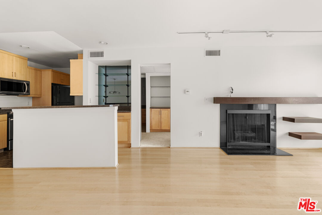 1302 Raintree Circle Culver City, CA 90230 - Photo 19 of 32 a view of a kitchen with an oven and cabinets