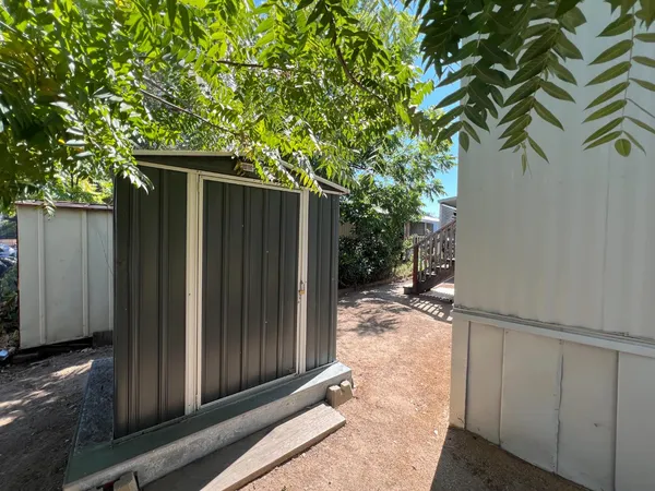 a backyard of a house with seating space