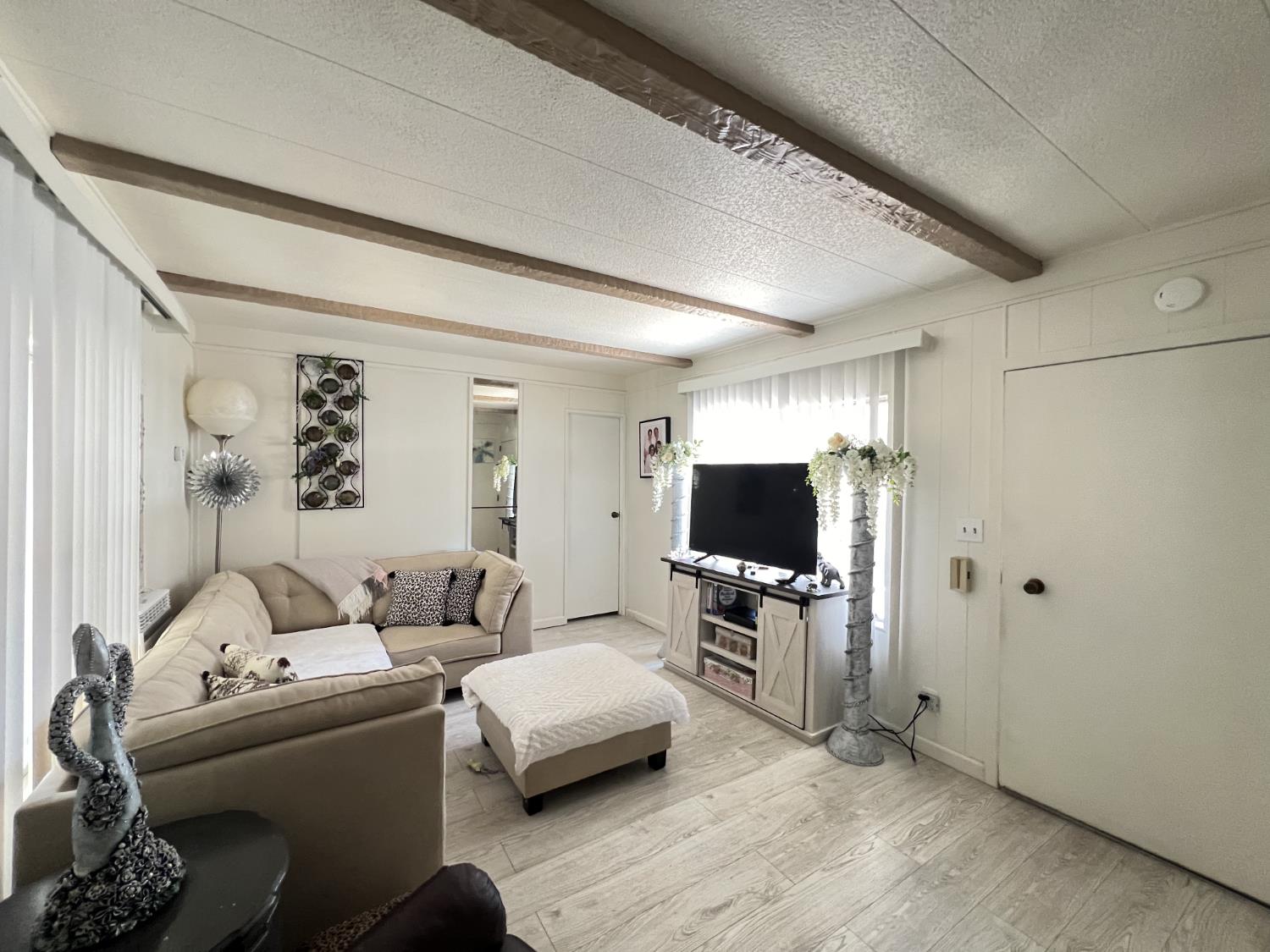 9060 Auburn Folsom Road, Unit 36 Granite Bay, CA 95746 - Photo 5 of 14 a living room with furniture and a flat screen tv