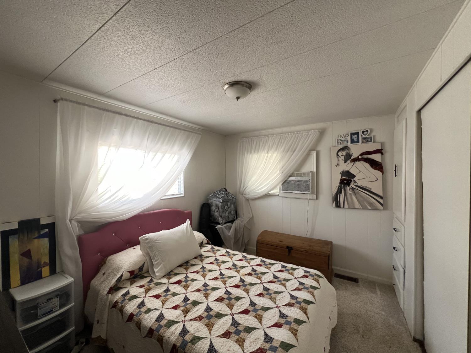 9060 Auburn Folsom Road, Unit 36 Granite Bay, CA 95746 - Photo 10 of 14 a bedroom with a bed and a window