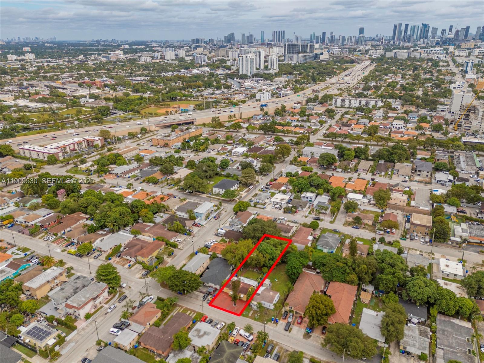 811 Northwest 24th Court Miami, FL 33125 - Photo 16 of 18 an aerial view of residential building with parking space