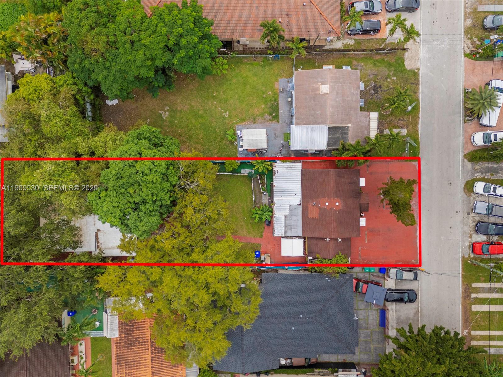 811 Northwest 24th Court Miami, FL 33125 - Photo 8 of 18 an aerial view of house with yard swimming pool and outdoor seating