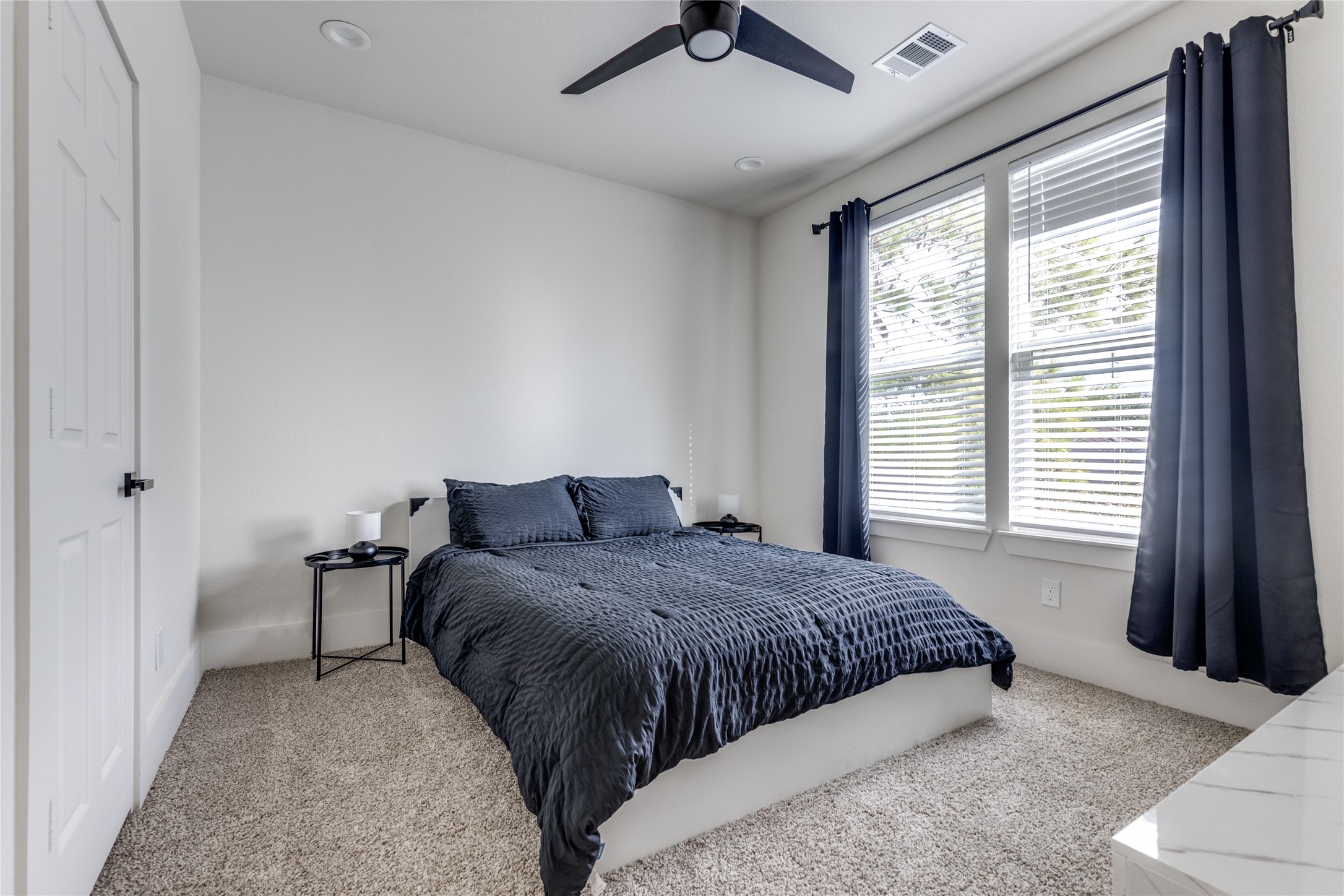 5618 Canal Street Houston, TX 77011 - Photo 7 of 13 Bed room 1 is located upstairs with plenty of natural light and neutral color carpet.